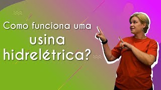 "Como funciona uma usina hidrelétrica?" escrito sobre fundo verde e roxo ao lado da imagem da professora