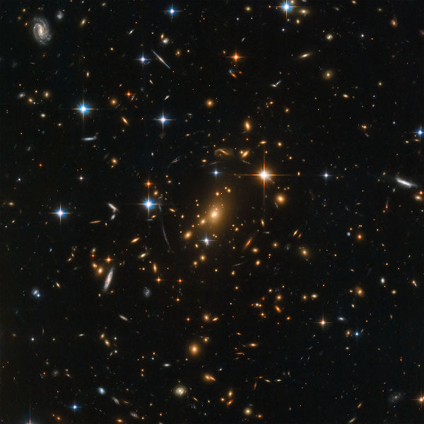 Na figura acima, produzida a partir de fotos do telescópio Hubble, é possível enxergar galáxias primitivas.