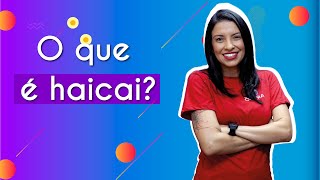 Professora ao lado do texto"O que é haicai?"