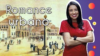 Professora ao lado do texto"Romance urbano" e representação de uma cidade.