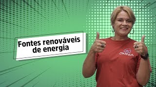 "Fontes renováveis de energia" escrito sobre fundo verde ao lado da imagem da professora