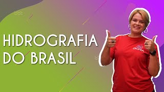 Professora ao lado do texto"Hidrografia do Brasil".