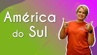 Escrito"América do Sul" ao lado da profesora.