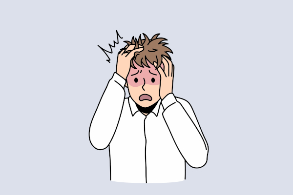 Homem estressado com as mãos na cabeça, em texto sobre “ansioso” ou “ancioso”.
