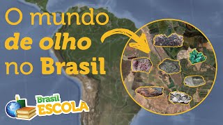 Texto "O mundo de olho no Brasil" escrito sobre mapa do Brasil com recorte de pedras preciosas na lateral, em alusão aos minerais do país.