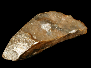 Machado de pedra lascada do período Paleolítico